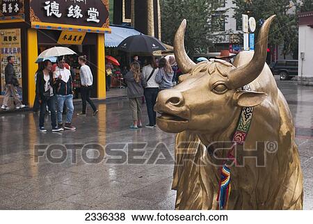 A Golden Ox Statue On A Rainy Day; Tibet, China View Large Photo Image Stock Photo - A Golden Ox Statue On A Rainy Day; Tibet, China. Fotosearch