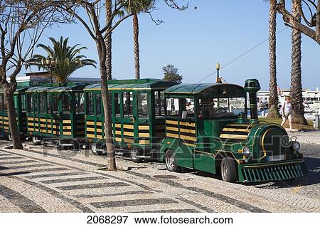 A Green Train Along The Road; Faro Algarve Portugal View Large Photo Image Stock Photo - A Green Train Along The Road; Faro Algarve Portugal. Fotosearch