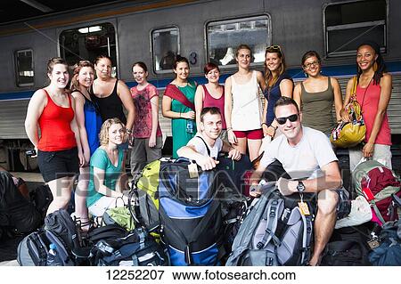 A group gets ready to board a train out of Bangkok's Hualamphong Station (Krungthep); Bangkok, Thailand View Large Photo Image Stock Photo - A group gets ready to board a train out of Bangkok's Hualamphong Station (Krungthep); Bangkok, Thailand. Fotosearch