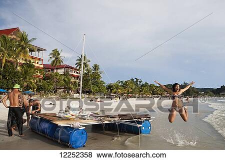 A group of backpackers decide to build their own raft and attempt to raft from Langkawi, Malaysia to Ko Lipe, Thailand; Cenang, Langkawi, Malaysia View Large Photo Image Stock Photo - A group of backpackers decide to build their own raft and attempt to raft from Langkawi, Malaysia to Ko Lipe, Thailand; Cenang, Langkawi, Malaysia. Fotosearch