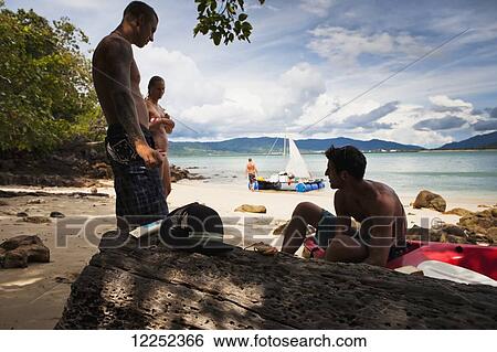 A group of backpackers decide to build their own raft and attempt to raft from Langkawi, Malaysia to Ko Lipe, Thailand; Cenang, Langkawi, Malaysia View Large Photo Image Stock Photograph - A group of backpackers decide to build their own raft and attempt to raft from Langkawi, Malaysia to Ko Lipe, Thailand; Cenang, Langkawi, Malaysia. Fotosearch