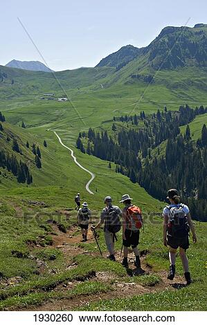 A group of hikers walking the Kitzbuehel region towards Bichlalm. KitzbŸhel alps. Tyrol, Austria. View Large Photo Image Stock Image - A group of hikers walking the Kitzbuehel region towards Bichlalm. KitzbŸhel alps. Tyrol, Austria.. Fotosearch
