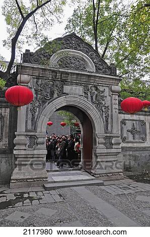 A Group Of People Stand On The Other Side Of An Ornate Stone Arch With Hanging Red Lanterns; Beijing China View Large Photo Image Stock Image - A Group Of People Stand On The Other Side Of An Ornate Stone Arch With Hanging Red Lanterns; Beijing China. Fotosearch