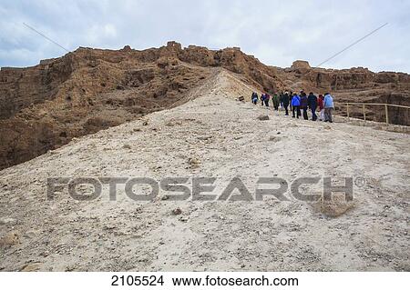 Picture - A Group Of People Walking Up A Path At The Ancient Fortification Masada; Israel. Fotosearch