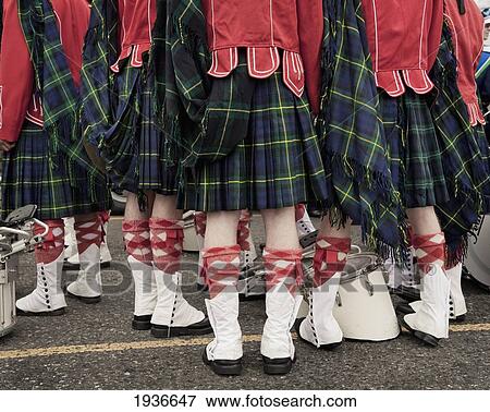 A Group Of People Wearing Kilts Red Jackets And White Boots For A Parade; Victoria British Columbia Canada View Large Photo Image Stock Photo - A Group Of People Wearing Kilts Red Jackets And White Boots For A Parade; Victoria British Columbia Canada. Fotosearch