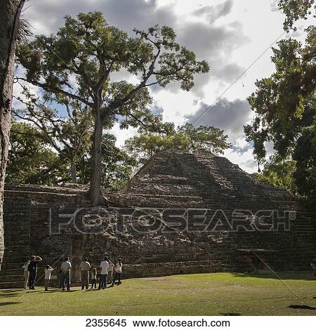 Stock Photography - A Group Of Tourists In A Maya Civilization At Copan Ruins; Copan, Honduras. Fotosearch