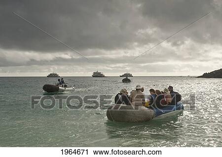 A Group Of Tourists In Inflatable Boats Out On The Water; Galapagos Equador View Large Photo Image Stock Image - A Group Of Tourists In Inflatable Boats Out On The Water; Galapagos Equador. Fotosearch