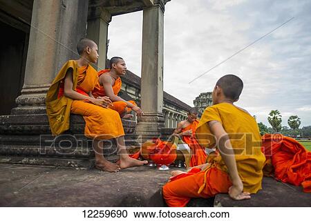 A group of young monks hang out at Angkor Wat; Siem Reap, Cambodia View Large Photo Image Stock Image - A group of young monks hang out at Angkor Wat; Siem Reap, Cambodia. Fotosearch