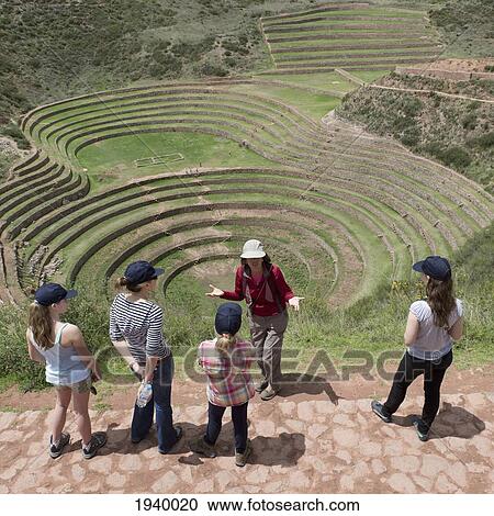A Group Of Young Women Overlook Concentric Ring Terraces As Part Of The Inca Ruins; Moray Peru View Large Photo Image Stock Image - A Group Of Young Women Overlook Concentric Ring Terraces As Part Of The Inca Ruins; Moray Peru. Fotosearch