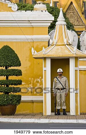 A Guard Stands Outside The Royal Palace; Phnom Penh Cambodia View Large Photo Image Stock Photo - A Guard Stands Outside The Royal Palace; Phnom Penh Cambodia. Fotosearch