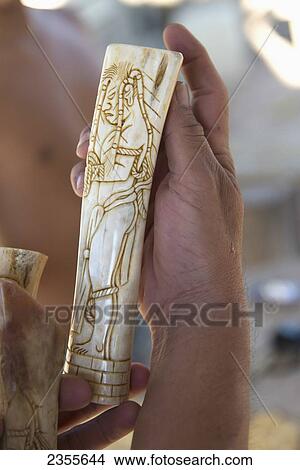 Picture - A Hand Holds Carved Handiwork; Copan, Honduras. Fotosearch