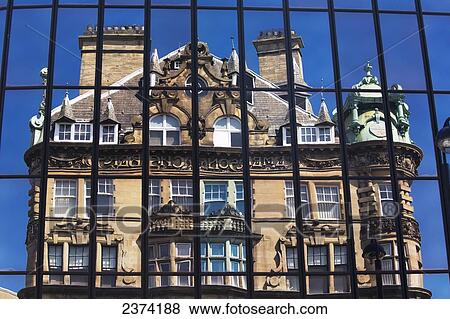 Stock Photo - A historic house viewed through a black metal gate; Newcastle, Tyne and Wear, England. Fotosearch