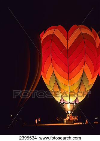A hot air balloon illuminated at nighttime; Tahlequah, Oklahoma, United States of America View Large Photo Image Picture - A hot air balloon illuminated at nighttime; Tahlequah, Oklahoma, United States of America. Fotosearch