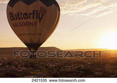 A hot air balloon in flight at sunset; Cappadocia, Turkey View Large Photo Image Stock Photography - A hot air balloon in flight at sunset; Cappadocia, Turkey. Fotosearch