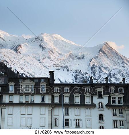 A Hotel With The Snowy French Alps In The Background; Chamonix-Mont-Blanc Rhone-Alpes France View Large Photo Image Stock Photograph - A Hotel With The Snowy French Alps In The Background; Chamonix-Mont-Blanc Rhone-Alpes France. Fotosearch