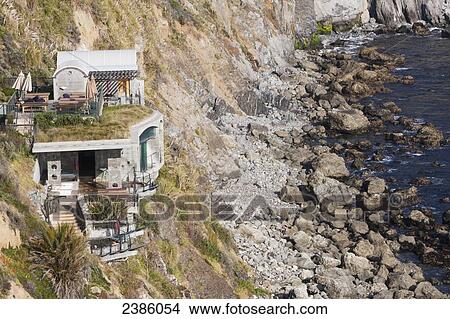 A house built on a ridge along the rocky coast; California, United States of America View Large Photo Image Picture - A house built on a ridge along the rocky coast; California, United States of America. Fotosearch