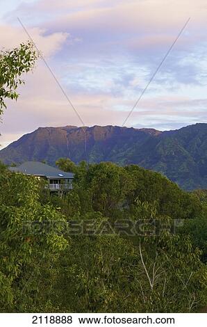 Stock Photo - A house with a view at sunset; Wailua, Kauai, Hawaii, United States of America. Fotosearch