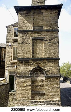 A house with bricked up windows as a result of the window tax in Saltaire, a Victorian Model Village; Bradford, West Yorkshire, England View Large Photo Image Stock Photo - A house with bricked up windows as a result of the window tax in Saltaire, a Victorian Model Village; Bradford, West Yorkshire, England. Fotosearch