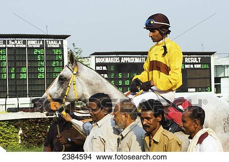 Picture - A jockey on a horse at Calcutta race course during the March St Leger meeting; Calcutta, West Bengal State, India. Fotosearch