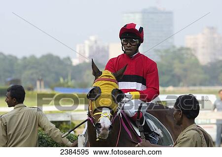 A jockey on a horse at Calcutta race course during the March St Leger meeting; Calcutta, West Bengal State, India View Large Photo Image Stock Photography - A jockey on a horse at Calcutta race course during the March St Leger meeting; Calcutta, West Bengal State, India. Fotosearch