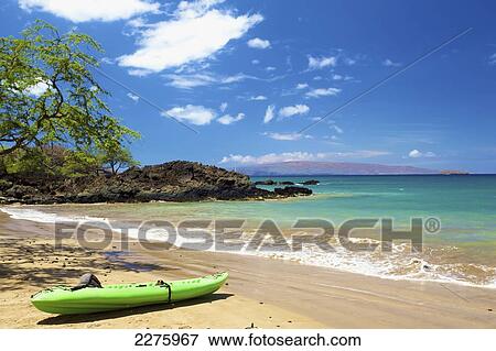 Stock Photo - A kayak on the beach of an hawaiian island; Hawaii, United States of America. Fotosearch
