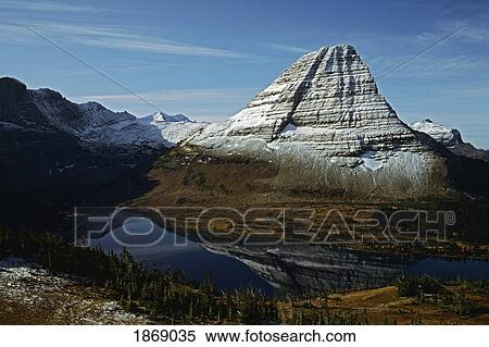 A Lake Reflecting Bearhat Mountain In Glacier National Park; Montana, Usa View Large Photo Image Stock Photography - A Lake Reflecting Bearhat Mountain In Glacier National Park; Montana, Usa. Fotosearch
