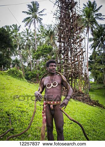 A land diver on Pentecost Island with the land diving tower behind him; Pentecost Island, Vanuatu View Large Photo Image Stock Photo - A land diver on Pentecost Island with the land diving tower behind him; Pentecost Island, Vanuatu. Fotosearch