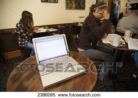 A laptop computer open on a cafe table; California, United States of America View Large Photo Image Stock Photography - A laptop computer open on a cafe table; California, United States of America. Fotosearch