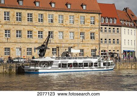 A Large Boat Docked Along The Water; Bamberg Bavaria Germany View Large Photo Image Stock Image - A Large Boat Docked Along The Water; Bamberg Bavaria Germany. Fotosearch