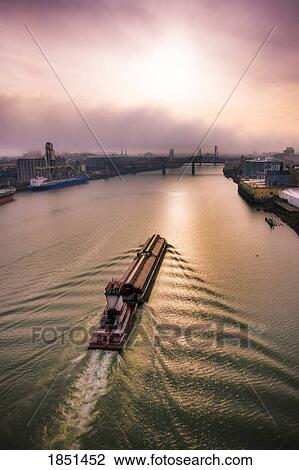 Stock Image - A Large Boat Sailing Through The Water; Portland, Oregon. Fotosearch