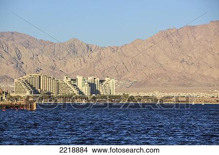 A Large Building And Mountains Along The Coast Of The Red Sea; Jordan Israel View Large Photo Image Picture - A Large Building And Mountains Along The Coast Of The Red Sea; Jordan Israel. Fotosearch