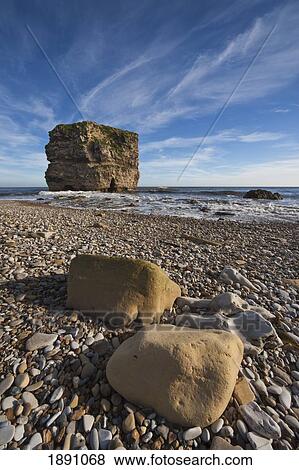 A Large Rock Formation In The Water Off The Coast; South Sheilds, Tyne And Wear, England View Large Photo Image Stock Photo - A Large Rock Formation In The Water Off The Coast; South Sheilds, Tyne And Wear, England. Fotosearch