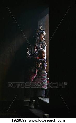 A Layap Girl Holding A Baby In Koina View Large Photo Image Stock Photo - A Layap Girl Holding A Baby In Koina. Fotosearch