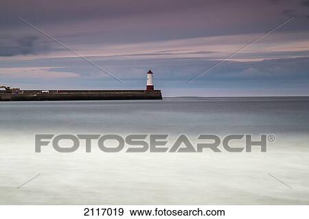 Stock Photo - A Lighthouse At The End Of A Pier; Berwick Northumberland England. Fotosearch