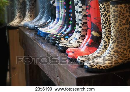A Line Of Multi-Patterned Rain Boots; British Columbia, Canada View Large Photo Image Stock Photo - A Line Of Multi-Patterned Rain Boots; British Columbia, Canada. Fotosearch