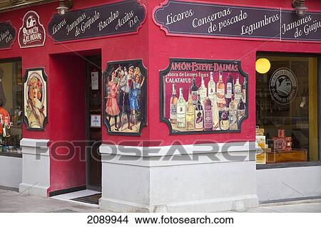 Picture - A Liquor Store On The Corner; Malaga, Andalusia, Spain. Fotosearch
