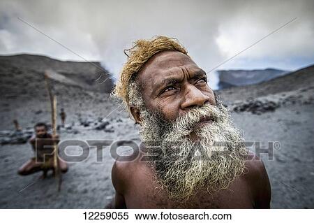 Stock Photography - A local landowner standing at the rim of Yasur Volcano; Tanna Island, Vanuatu. Fotosearch
