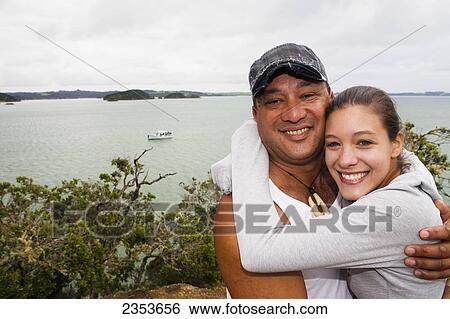 A Local Maori Befriends A Backpacker In The Bay Of Islands; New Zealand View Large Photo Image Stock Photograph - A Local Maori Befriends A Backpacker In The Bay Of Islands; New Zealand. Fotosearch