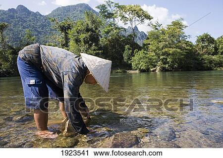 A Local Woman Standing In A River, Vang Vieng, Laos View Large Photo Image Stock Image - A Local Woman Standing In A River, Vang Vieng, Laos. Fotosearch