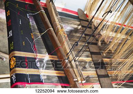 A loom for weaving used in a remote Northern Laos village; Vieng Thong, Laos View Large Photo Image Picture - A loom for weaving used in a remote Northern Laos village; Vieng Thong, Laos. Fotosearch