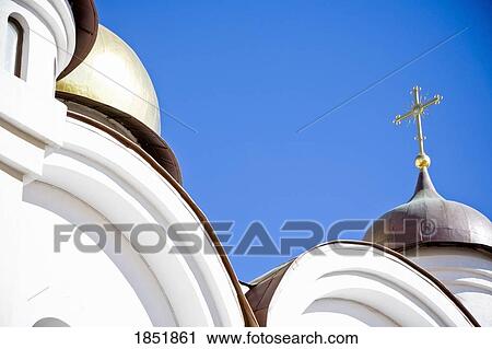 Stock Image - A Low Angle Shot Of A White Church. Fotosearch