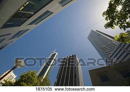 Stock Photography - A Low Angle View Of Skyscrapers In A City Centre. Fotosearch