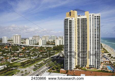 A luxury condominium tower block on the sand in Sunny Isles Beach; Aventura, Florida, United States of America View Large Photo Image Stock Photograph - A luxury condominium tower block on the sand in Sunny Isles Beach; Aventura, Florida, United States of America. Fotosearch