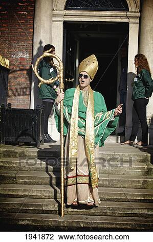 Stock Image - A Man Dressed In Costume For The Saint Patrick's Day Parade; Dublin Ireland. Fotosearch
