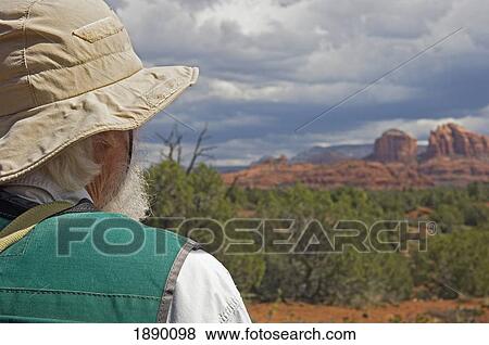 A Man Looking Out Over Red Rock State Park. View Large Photo Image Stock Photo - A Man Looking Out Over Red Rock State Park.. Fotosearch
