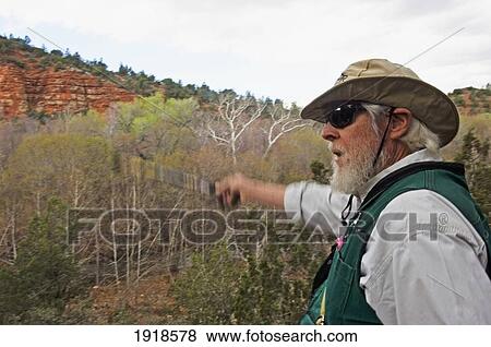 A Man On A Nature Walk At Red Rock State Park, Arizona, Usa View Large Photo Image Stock Photo - A Man On A Nature Walk At Red Rock State Park, Arizona, Usa. Fotosearch