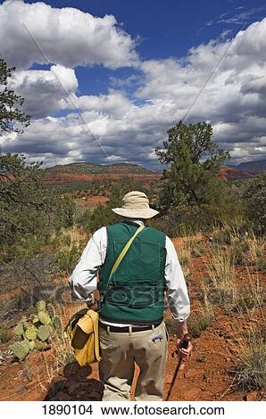 Picture - A Man On A Nature Walk Through Red Rock State Park.. Fotosearch
