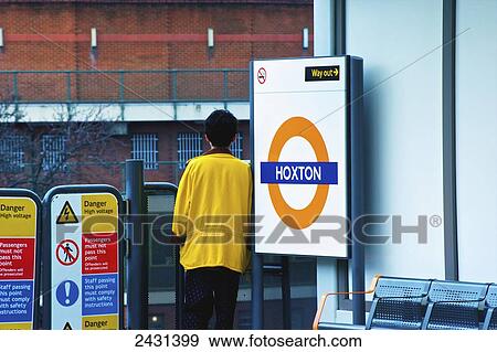 A man waits at the Hoxton railway station; London, England View Large Photo Image Stock Photo - A man waits at the Hoxton railway station; London, England. Fotosearch
