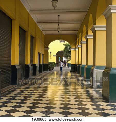 A Man Walks Down The Corridor In The Historic Centre Of Lima; Lima Peru View Large Photo Image Stock Photography - A Man Walks Down The Corridor In The Historic Centre Of Lima; Lima Peru. Fotosearch