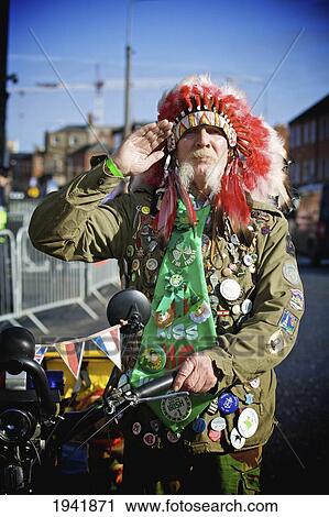 A Man Wearing A Feather Headdress For The Saint Patrick's Day Parade; Dublin Ireland View Large Photo Image Stock Image - A Man Wearing A Feather Headdress For The Saint Patrick's Day Parade; Dublin Ireland. Fotosearch
